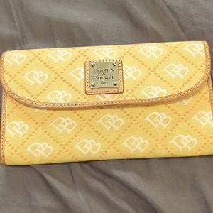 Vintage Dooney & Bourke cloth and leather Gretta Continental clutch in yellow